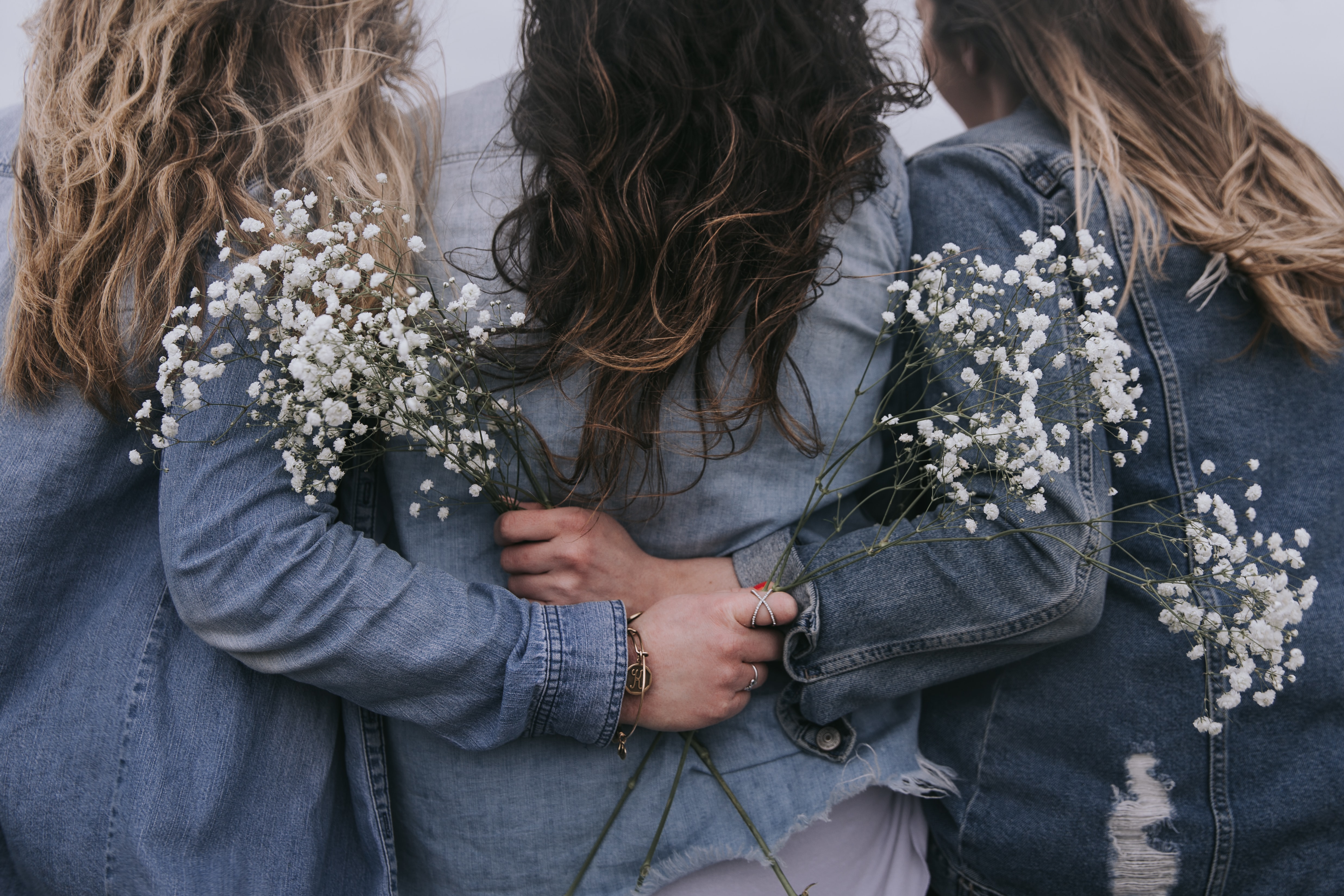 friends holding flowers